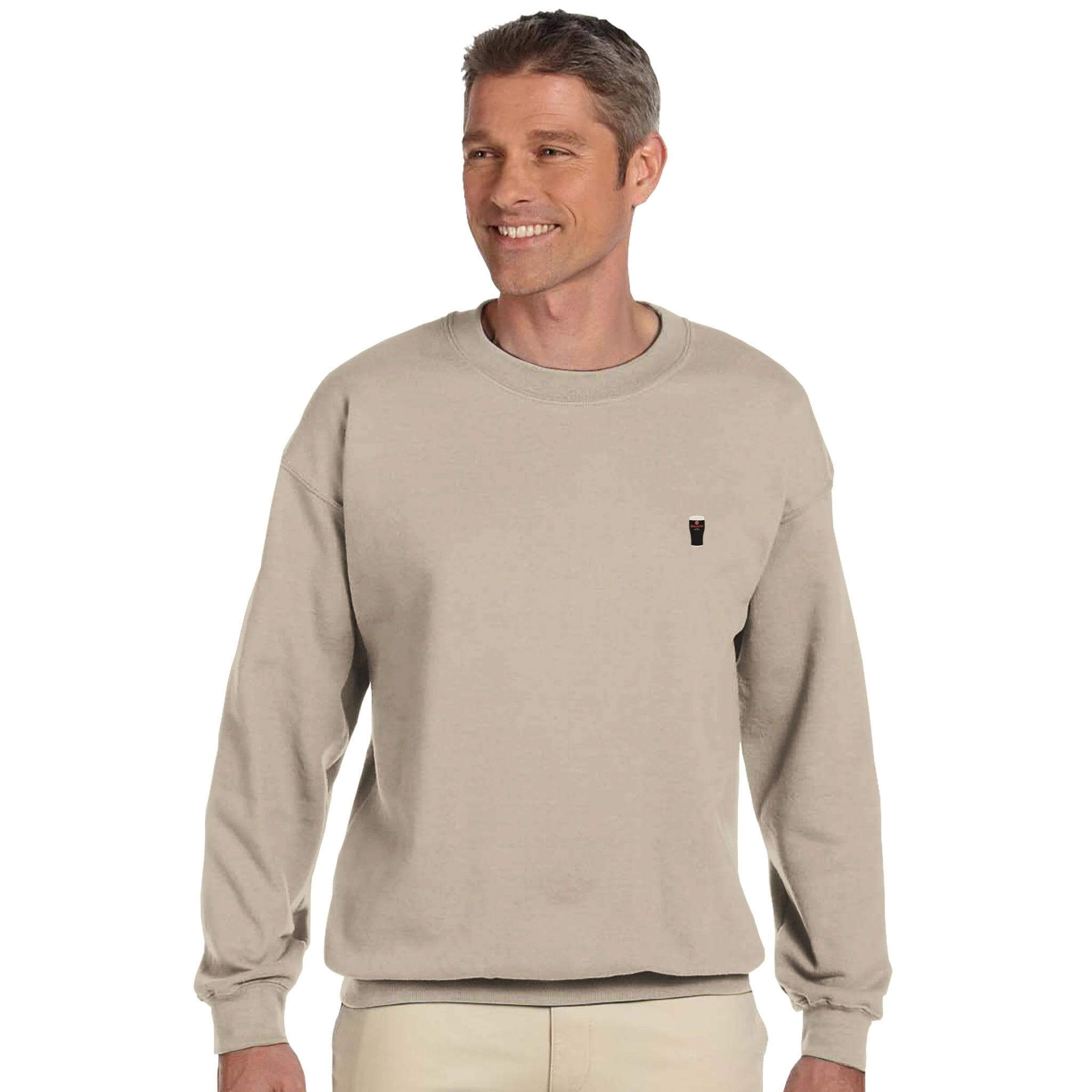 Man wearing creamy Beamy Irish stout sweatshirt, showcasing comfort and style for Beamish drinkers.