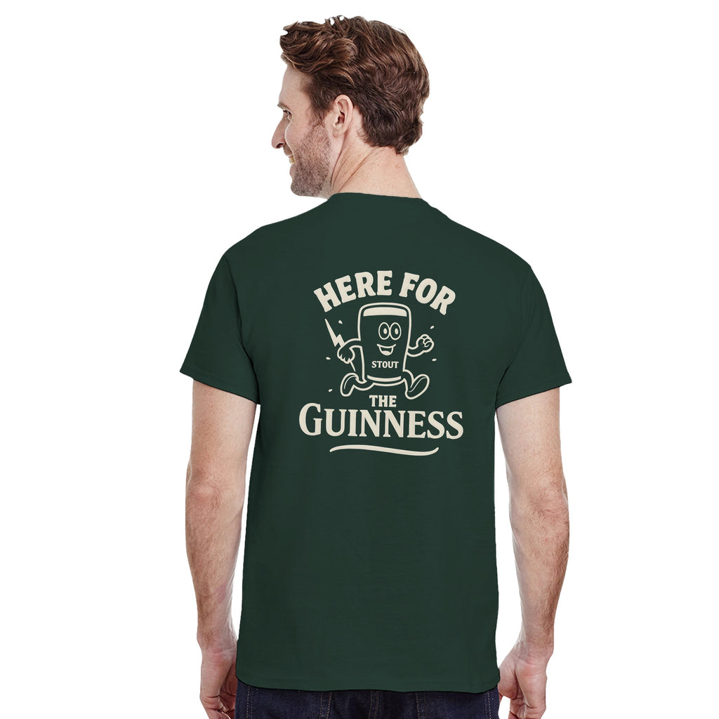 Back view of a man wearing a green oversized tee with a retro pint graphic and 'Here for the Guinness' text.