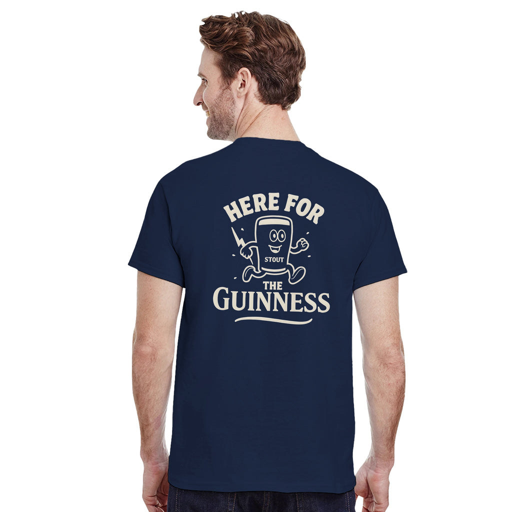 Man wearing oversized navy tee with retro stout graphic and 'Here for the Guinness' text.