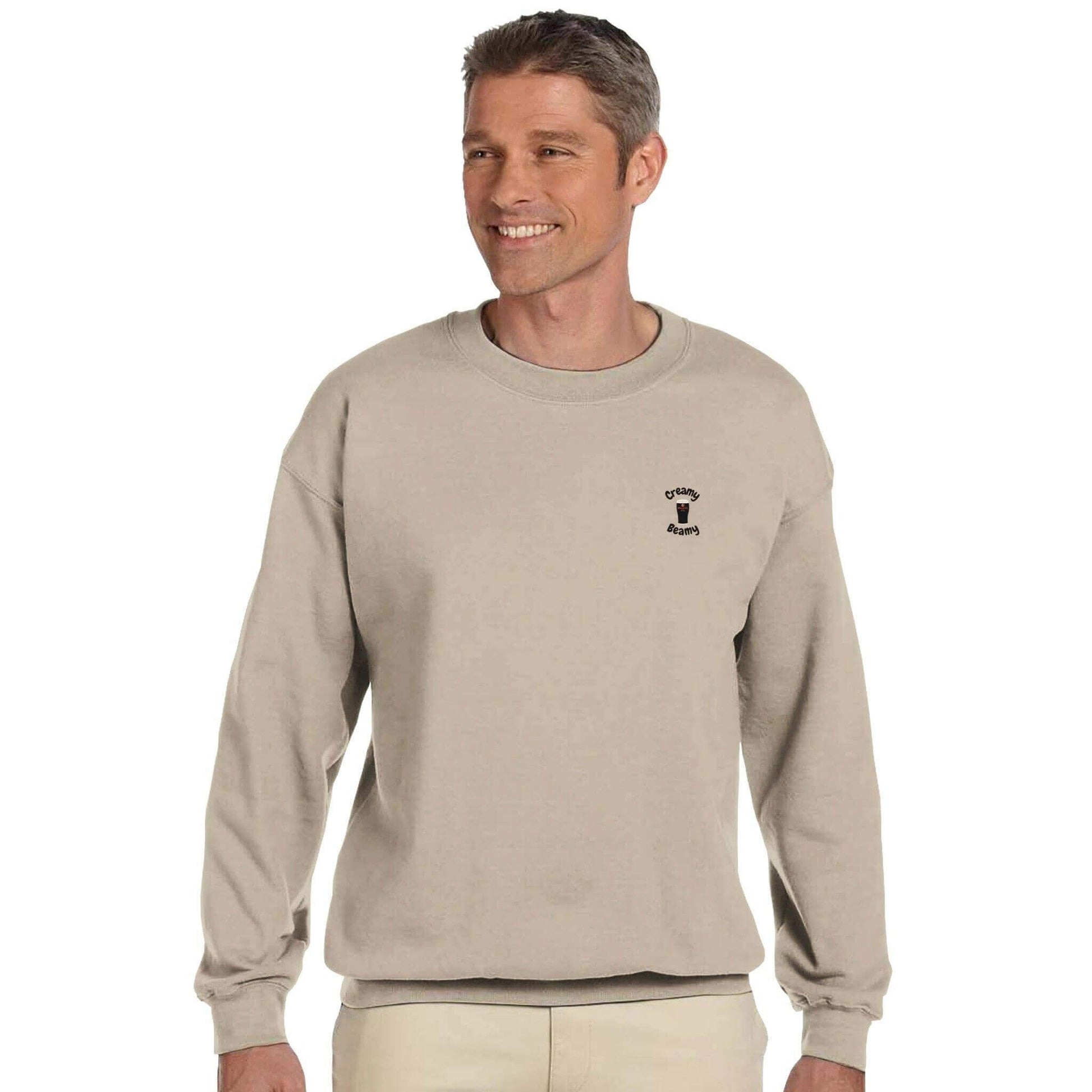 Cheerful man wearing a Creamy Beamy Beamish Irish Stout sweatshirt, showcasing comfort and style with a cozy fit.