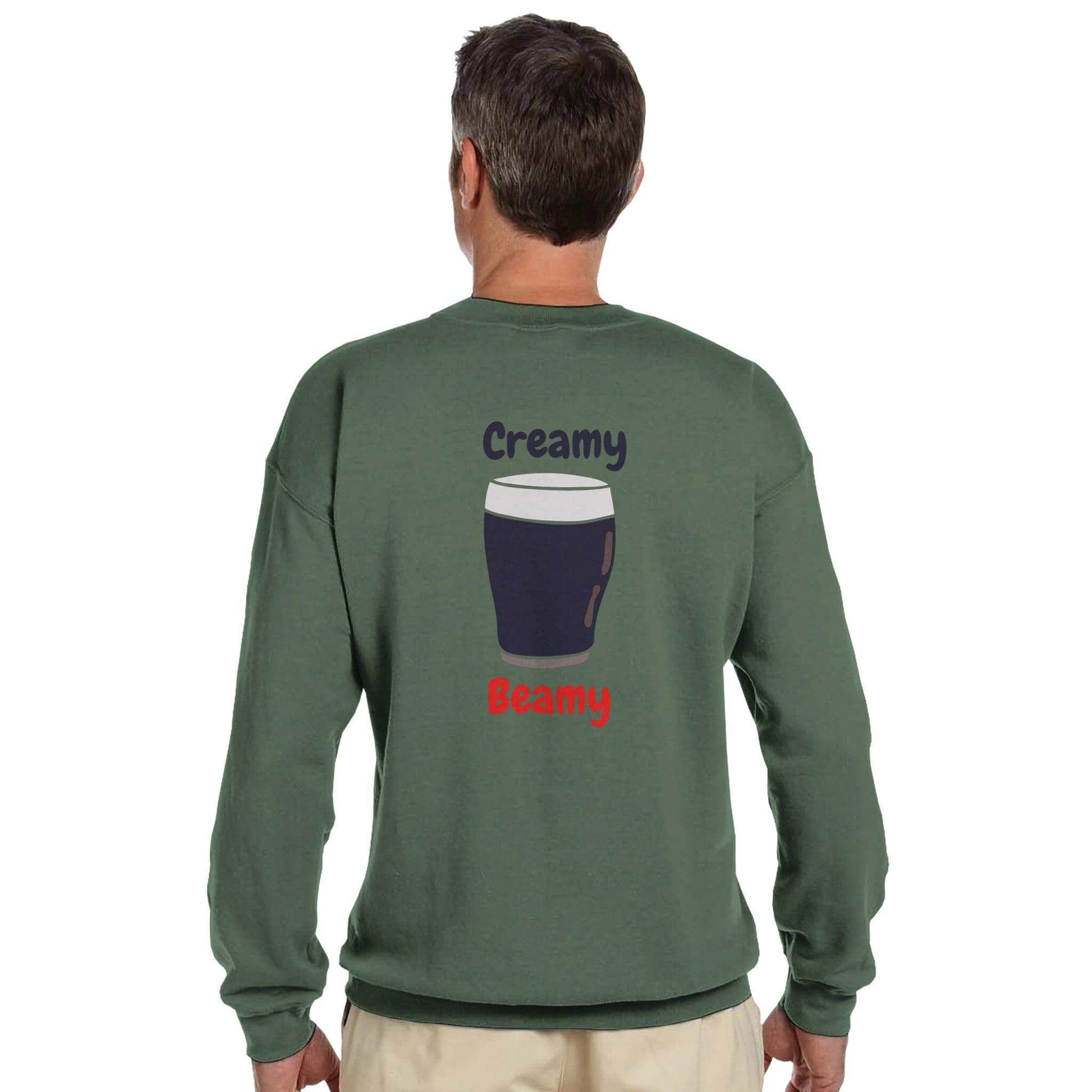 Back view of a man wearing a Creamy Beamy Irish Stout sweatshirt featuring a pint graphic.