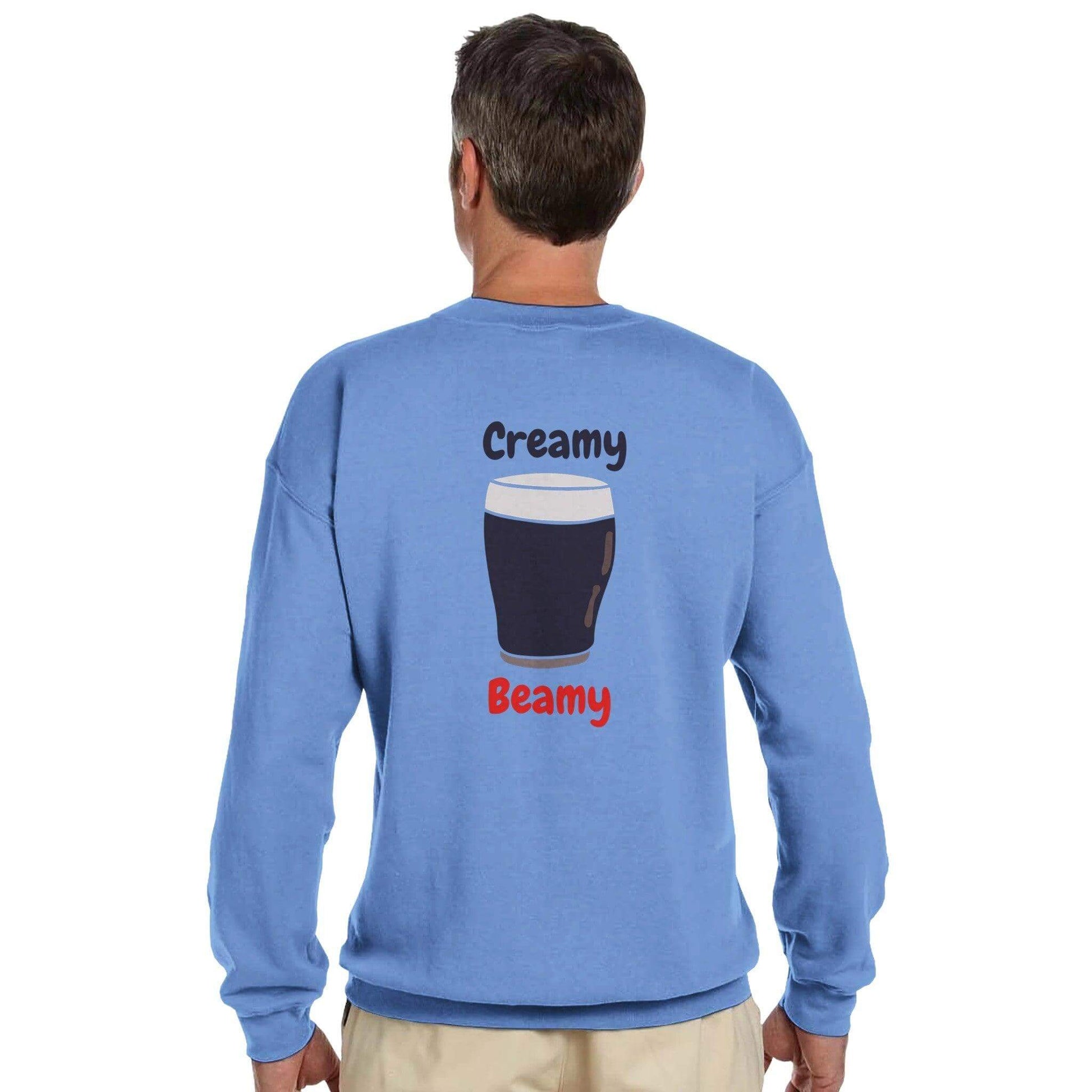 Back view of a blue sweatshirt featuring a creamy stout illustration with the words 'Creamy Beamy' for Irish stout lovers.