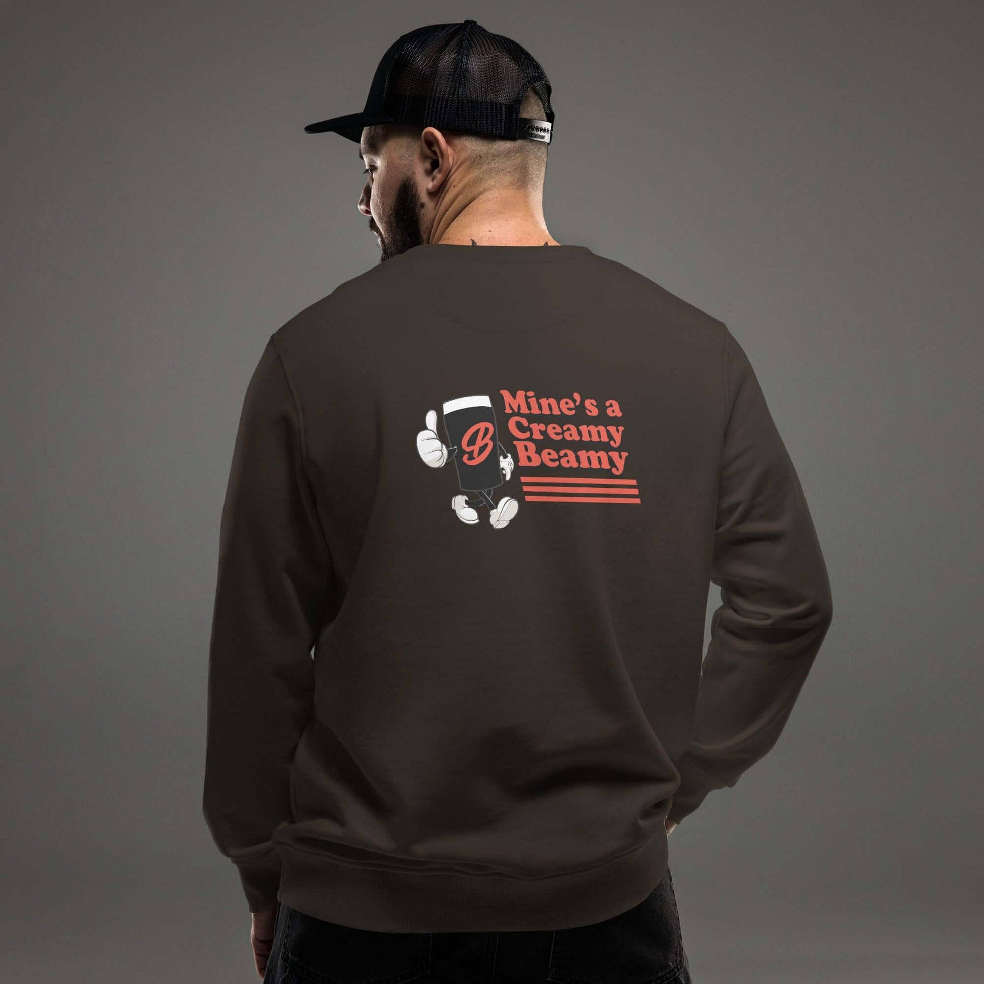 Back view of man wearing Creamy Beamy Organic Sweatshirt with vintage pint design.