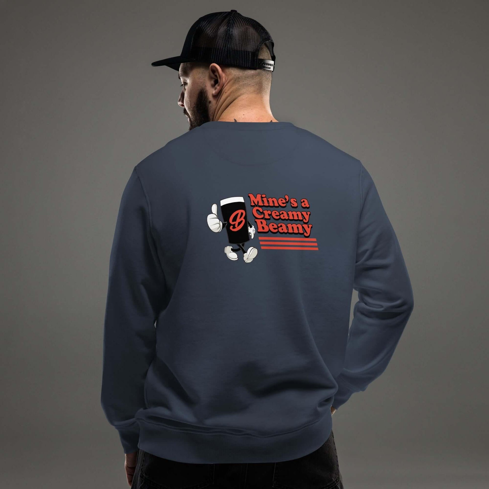 Model wearing Creamy Beamy Organic Sweatshirt, showcasing vintage pint-inspired design on back.