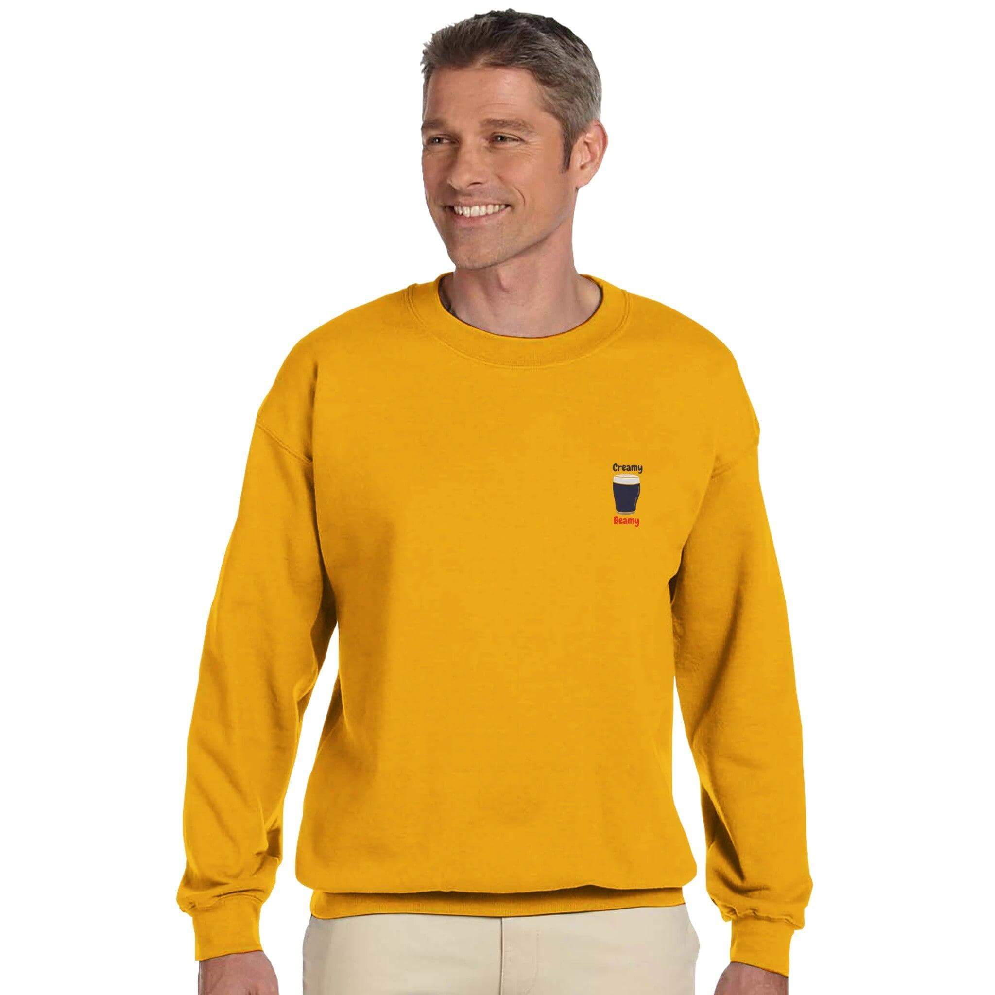 Man wearing Creamy Beamy's Jumper, a vibrant yellow sweatshirt for Beamish Stout lovers, showcasing comfort and style.