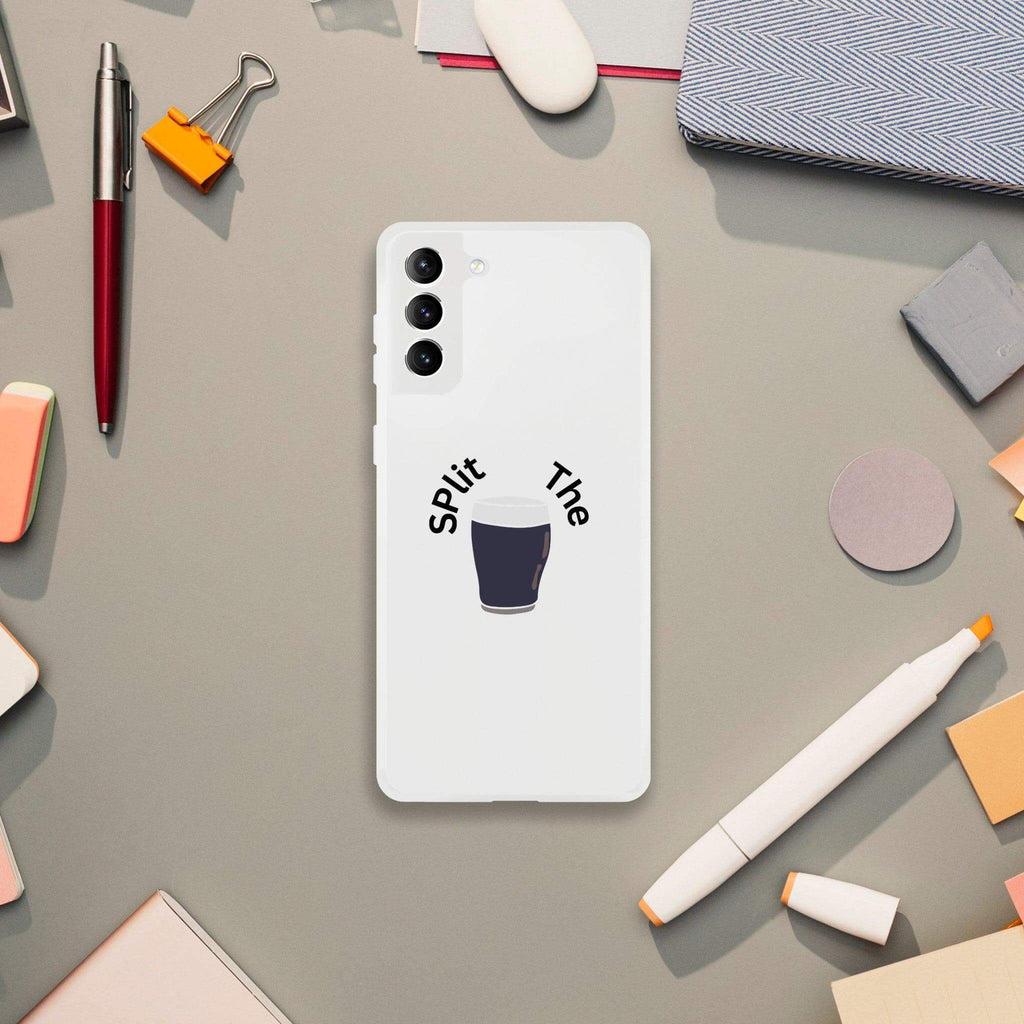 Guinness-themed Split the G Phone Case displayed on a desk among office supplies, showcasing its unique design.