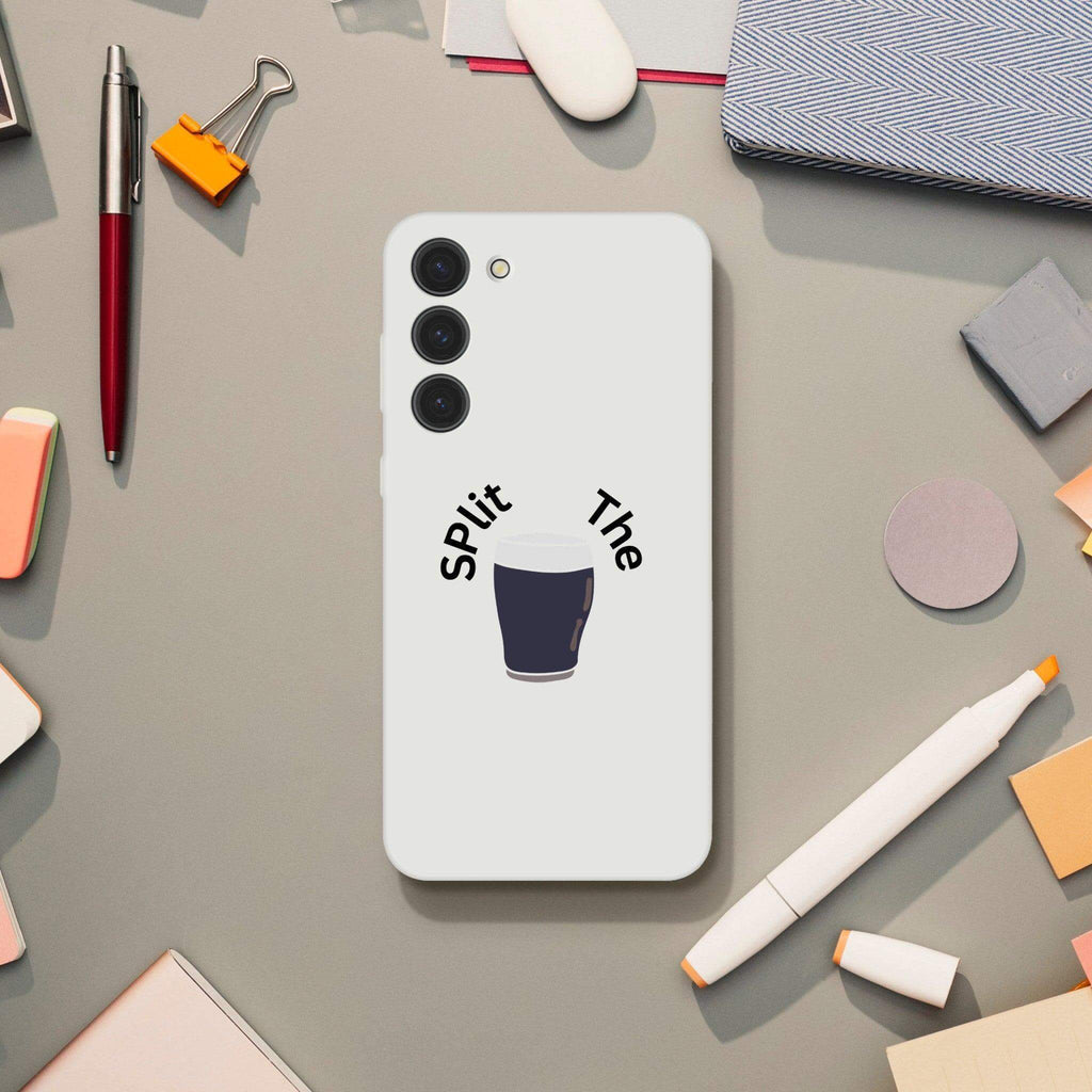 Guinness-inspired Split the G phone case on a stylish work desk, perfect for beer lovers.